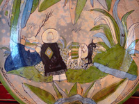 Mexican vintage pottery and ceramics, a wonderful, large charger with very lovely background glazing, Tlaquepaque, Jalisco, 1938. Closeup photo of part of the front of the Tlaquepaque pottery charger.