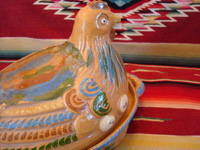 Mexican vintage pottery and ceramics, and Mexican vintage folk-art, a wonderful lidded pottery casserole in the shape of a nesting hen, Tonala or Tlaquepaque, Jalisco, c. 1930's. Closeup photo of one side of the head of the tlaquepaque pottery hen.