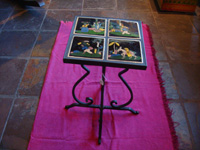 Mexican vintage pottery and ceramics, a wrought-iron table with four matching black-ware tiles, the tiles from Tlaquepaque, Jalisco, c. 1930's. Main photo of the tile-top table.