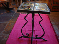 Mexican vintage pottery and ceramics, a wrought-iron table with four matching black-ware tiles, the tiles from Tlaquepaque, Jalisco, c. 1930's. Side-view of the tile-top table.