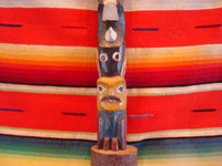 Native American Indian vintage folk art, a beautiful, hand-carved cedar, Northwest Coast totem pole, Haida (British Columbia), c. 1930's or earlier. The pole features an eagle, a killer-whale, and a wonderful bear. Closeup of a part of the Northwest Coast, Haida, totem pole.