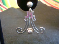 Mexican vintage silver jewelry, and Taxco vintage sterling silver jewelry, a wonderful and very graceful pair of Taxco silver dangling earrings, Taxco, c. 1940's. Closeup photo of one of the Taxco vintage silver earrings.