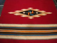 Mexican vintage textiles and serapes, and New Mexican vintage textiles, a wonderful textile from Chimayo, New Mexico, c. 1920's-1930's. Closeup photo of a design on the front.