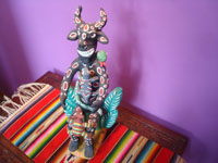Mexican vintage folk art, a wonderful pottery sculpture from Ocumicho, Michoacan, depicting a playful devil with a snake wrapped around his head, a reptile crawling up his stomach, and a pesky rodent holding on to his knees, Ocumicho, Michoacan, c. 1970. Main photo of the Ocumicho figure.