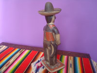 Mexican vintage folk art, a wonderful pottery figure of a cowboy, Guerrero, c. 1950's. A photo of the back of the cowboy showing his trusty machete.