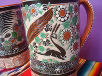 Mexican vintage pottery and ceramics, a set of three pottery petatillo (background of fine cross-hatching resembling a straw mat or petate, in Spanish) chocolate cups, with fabulous artwork, signed by the great Jose Bernabe, Tonala or San Pedro Tlaquepaque, c. 1930's. Closeup photo of another cup showing the lovely floral decorations.