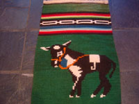 Mexican vintage textiles and serapes, a wonderful pictorial textile featuring an adorable donkey, with a tight weave and bold colors, Zacatecas, 1950's.  Closeup photo of the donkey.