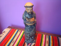 Mexican devotional art, a woodcarving of St. Francis of Assisi, beautifully carved and covered with beautiful milagros front and back, Michoacan, c. 1950's.  Main photo of the wooden statue.