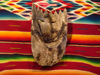 Mexican vintage wood-carving and Mexican vintage folk art, a mask of a European king used in dance celebrations in Apaxtla, Puebla, c. 1920. Photo of the back side of the mask.