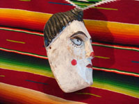Guatemalan vintage wood-carving and folk art, a carved wooden mask used in dances, Guatemala, c. 1940's. Photo of the side of the mask.