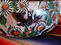 Mexican vintage pottery and folk art, a lovely petatillo casserole with lid, Tonala, Jalisco, c. 1950-60, by famed artist Jose Bernabe. The casserole features wonderful and very intricate floral and zoomorphic figures. Closeup photo.