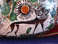 Mexican vintage pottery and folk art, a lovely petatillo casserole with lid, Tonala, Jalisco, c. 1950-60, by famed artist Jose Bernabe. The casserole features wonderful and very intricate floral and zoomorphic figures. Closeup photo of a lion decoration the petatillo cassserole.