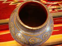 Mexican vintage pottery and ceramics, a beautiful Tonala burnished vase or large jar with a blue background and a "starry-night" background-design, Tonala, Jalisco, c. 1930. A photo shot from above the Tonala burnished pottery vase, looking down.