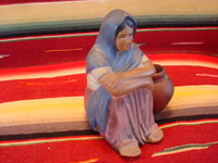 Mexican vintage pottery and ceramics, a lovely Tlaquepaque pottery figurine of a seated woman with her jarron (large pottery water jar), Tlaquepaque, c. 1920's. Main photo of the Tlaquepaque pottery figurine.