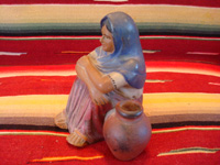 Mexican vintage pottery and ceramics, a lovely Tlaquepaque pottery figurine of a seated woman with her jarron (large pottery water jar), Tlaquepaque, c. 1920's. Another view of the Tlaquepaque pottery figurine.