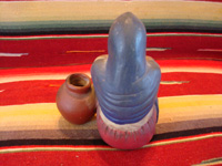 Mexican vintage pottery and ceramics, a lovely Tlaquepaque pottery figurine of a seated woman with her jarron (large pottery water jar), Tlaquepaque, c. 1920's. A photo showing the back side of the Tlaquepaque pottery figurine.
