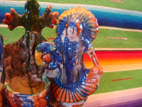 Mexican vintage folk art, and Mexican vintage pottery and ceramics, a drip-ware pottery piece depicting a lovely Tehuana maiden and a dashing caballero at a water well, Oaxaca, c. 1940-50's. Closeup photo of the Tejuana maiden.