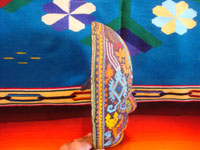 CI-13: Mexican vintage woodcarvings and masks, a beautiful beaded Huichol mask with very intricate and crisp design elements, the Sierras of Nyarite, c. 1950's. A side view of the mask, showing its thickness, front to back.