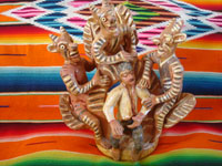 Mexican vintage folk art, and Mexican vintage pottery and ceramics, a wonderful pottery sculpture of a young man who is getting "advice" from three mischievious devils, Ocumicho, Michoacan, c. 1940-50's. Main photo of the Ocumicho pottery piece.