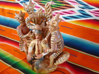 Mexican vintage folk art, and Mexican vintage pottery and ceramics, a wonderful pottery sculpture of a young man who is getting "advice" from three mischievious devils, Ocumicho, Michoacan, c. 1940-50's. Side view of the pottery piece from Ocumicho.