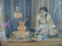 Mexican vintage straw art, popote art or popotillo, a very fine straw-art picture of a Mexican woman preparing masa to put tortillas on the comal, attributed to the great artist G. Olay, c. 1930's.  Closeup photo of the woman preparing masa.