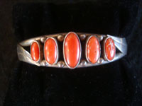 Native American Indian sterling silver jewelry, and Navajo vintage silver jewelry, a beautiful silver bracelet decorated with lovely coral, Navajo, Arizona or New Mexico, c. 1960's. Main photo of the bracelet.