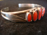 Native American Indian sterling silver jewelry, and Navajo vintage silver jewelry, a beautiful silver bracelet decorated with lovely coral, Navajo, Arizona or New Mexico, c. 1960's. A side view of the Navajo bracelet.