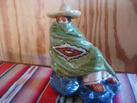 Mexican vintage folk art, and Mexican vintage pottery and ceramics, a lovely glazed statue of a Mexican gentleman relaxing and peering over the edge of his wonderful serape (sarape), Tonala or San Pedro Tlaquepaque, c. 1940.  Main photo of the gentleman.