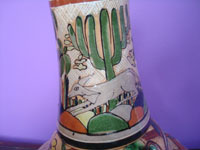 Mexican vintage pottery and ceramics, a pottery water bottle and cup with incredi bly fine artwork, Tonala or San Pedro Tlaquepaque, c. 1930's. Closeup photo of the cup on top of the far.