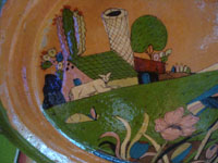 Mexican vintage pottery and ceramics, a beautiful pottery oval platter with very fine artwork and a lovely tangerine-colored background, San Pedro Tlaquepaque, c. 1930's. A closeup photo of other artwork on the platter.