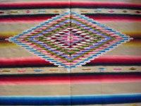Mexican vintage textile, a Saltillo sarape, a closeup photo of the center diamond.