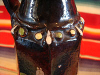Mexican vintage pottery and folk art, a pair of blackware pouring vessels from Tlaquepaque, Jalisco, c. 1930-40. The vessels are decorated with very inticate scenes. Photo of the bump-out decoration near the neck of the vessels.