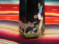 Mexican vintage pottery and folk art, a pair of blackware pouring vessels from Tlaquepaque, Jalisco, c. 1930-40. The vessels are decorated with very inticate scenes. Closeup of the burro on the vessel.