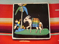 Mexican vintage pottery and folk art, a blackware tile with a scene of a very endearing and whimsical burro amidst plants and foliage, Tlaquepaque, Jalisco, c. 1930's. Main photo of the front of the entire tile.