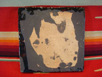 Mexican vintage pottery and folk art, a blackware tile with a scene of a very endearing and whimsical burro amidst plants and foliage, Tlaquepaque, Jalisco, c. 1930's. Photo of the back side of the tile.