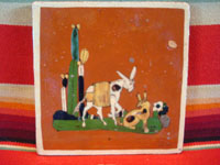 Mexican vintage pottery and folk art, a tile with terra cotta colored field and with a scene of a burro and doggie, Tonala, Jalisco, c. 1940's. Main photo of the entire front side of the tile.