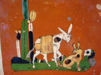 Mexican vintage pottery and folk art, a tile with terra cotta colored field and with a scene of a burro and doggie, Tonala, Jalisco, c. 1940's. Closeup photo of the burro and doggie.
