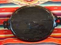 Mexican vintage pottery and folk art, a wonderful oval blackware charger with handles, Tlaquepaque, Jalisco, c. 1920-30's. This is an incredible piece of vintage Mexican pottery and a true treasure for the discerning collector! A photo showing the back of the charger.