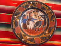Mexican vintage pottery and ceramics, a beautiful burnished charger with very intricate decoration, by famous Master Artist of Mexican Folkart Pottery, Salvador Vasquez, Tonala, c. 1960. Another photo of the front of the charger.