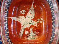 Mexican vintage pottery and ceramics, a lovely bandera-ware rectangular dish with a graceful eagle, Tonala or Tlaquepaque, Jalisco, c. 1930's. The dish is in the traditional colors of bandera-ware, earthen-red, green, and white, the colors of the Mexican flag, or bandera in Spanish. Closeup photo of the eagle.