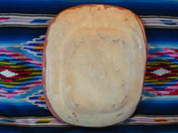 Mexican vintage pottery and ceramics, a lovely bandera-ware rectangular dish with a graceful eagle, Tonala or Tlaquepaque, Jalisco, c. 1930's. The dish is in the traditional colors of bandera-ware, earthen-red, green, and white, the colors of the Mexican flag, or bandera in Spanish. Photo of the back side of the pottery dish.