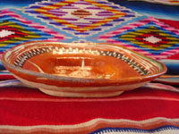 Mexican vintage pottery and ceramics, a lovely bandera-ware rectangular dish with a graceful eagle, Tonala or Tlaquepaque, Jalisco, c. 1930's. The dish is in the traditional colors of bandera-ware, earthen-red, green, and white, the colors of the Mexican flag, or bandera in Spanish. Photo giving a side-view of the dish.