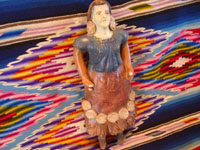 Mexican vintage pottery and ceramics and Mexican vintage folk-art, a wonderful bank in the form of a lovely Mexican woman, c. 1940's. The woman's face is very serene and beautiful, and the doll-bank has great patina. Another angle of the folk-art, pottery bank.
