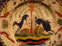 Mexican vintage pottery and ceramics, a magnificent Tlaquepaque plate with a starry-night background and decorated with leaping animals and birds, Tlaquepaque, Jalisco, c. 1920-30's. Attributed to the famous artist of that period, Balbino Lucano, or to his equally talented brother, Tomas Lucano. Closeup photo of central design of Tlaquepaque pottery plate.