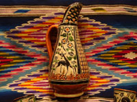 Mexican vintage pottery and ceramics, a beautiful petatillo (cross-hatching in the background, resembling a straw-mat or petate in Spanish) pulque pitcher, decorated with wonderful animals and foliage and with 6 finely decorated petatillo cups, Tlaquepaque, Jalisco, c. 1940's. Another view of the petatillo pottery pitcher.