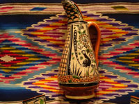 Mexican vintage pottery and ceramics, a beautiful petatillo (cross-hatching in the background, resembling a straw-mat or petate in Spanish) pulque pitcher, decorated with wonderful animals and foliage and with 6 finely decorated petatillo cups, Tlaquepaque, Jalisco, c. 1940's. A view of another side of the petatillo pottery pitcher.