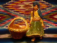 Mexican vintage pottery and ceramics and Mexican vintage folk-art, a lovely pottery figurine depicting a lovely woman with a basketl, Tonala or Tlaquepaque, Jalisco, c. 1930's. The woman's face is incredibly beautiful. Main photo of the Tlaquepaque pottery maiden.