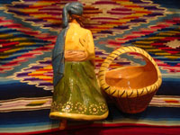 Mexican vintage pottery and ceramics and Mexican vintage folk-art, a lovely pottery figurine depicting a lovely woman with a basketl, Tonala or Tlaquepaque, Jalisco, c. 1930's. The woman's face is incredibly beautiful. Photo of the back side of the Tonala or Tlaquepaque pottery maiden with basket.