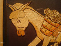 Mexican vintage straw-art (popote art or popotillo), a wonderful popote art scene of a boy riding his trusty burro, laden with goods, to the local market, c. 1940's. This piece of Mexican popote art is comprised of thousands of minute pieces of dyed straw; this is very labor intensive and wonderful! Closeup view of the burro's wonderful face.