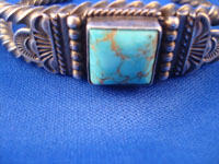 Native American Indian vintage silver jewelry, and Navajo vintage silver jewelry, a stunning silver bracelet with a very fine turquoise stone, Arizona or New Mexico, c. 1950's. Closeup photo of the turquoise stone on the Navajo silver jewelry bracelet.